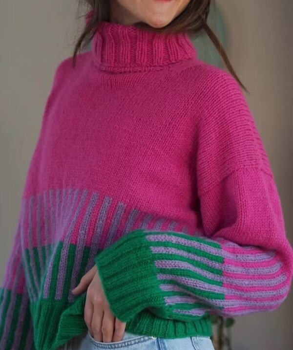 woman wearing colorful color blocking sweater and jeans