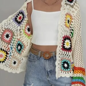 woman wearing colorful crochet cardigan, showing its inside material