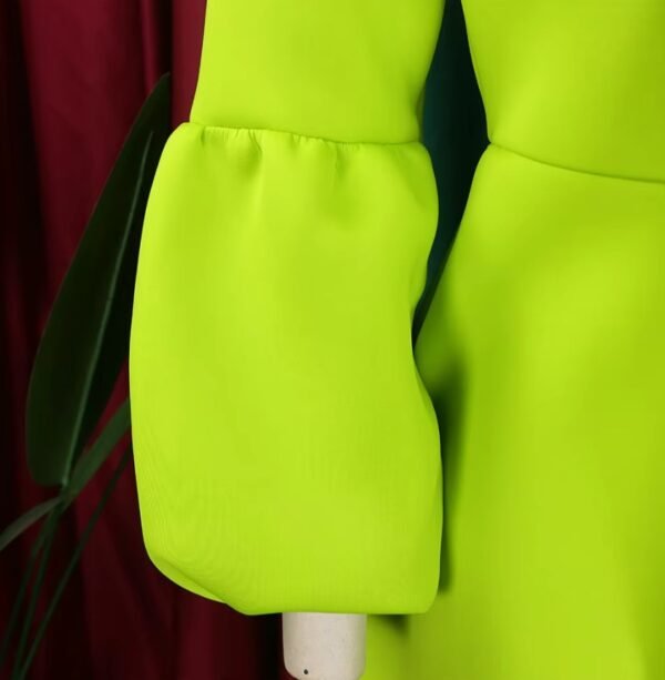 sleeve of green colorful dress with a bow