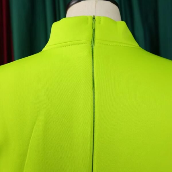 zipper of green colorful dress with a bow