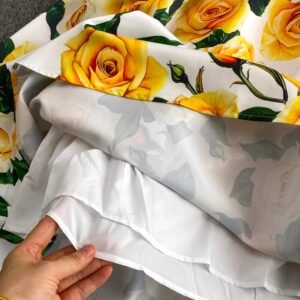 inside material of colorful dress with yellow roses