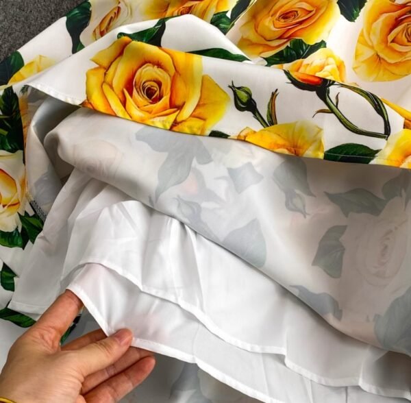 inside material of colorful dress with yellow roses