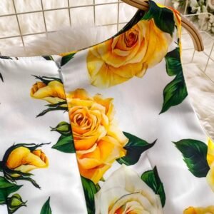 sleeve of colorful dress with yellow roses