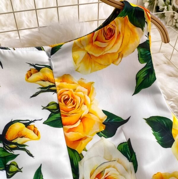 sleeve of colorful dress with yellow roses