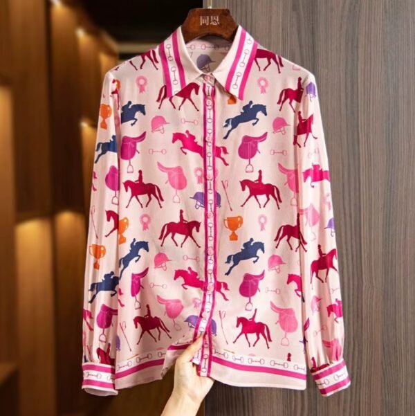 colorful horse blouse on a hanger