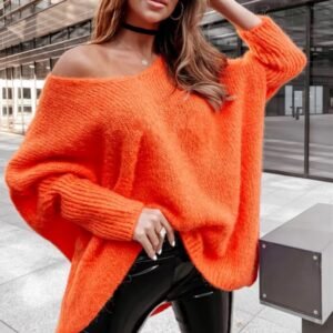 woman wearing orange colorful knitted sweater and black pencil skirt on the street