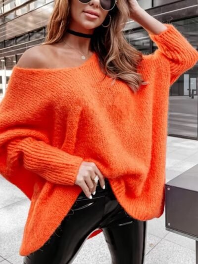 woman wearing orange colorful knitted sweater and black pencil skirt on the street