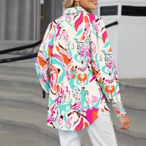 woman turned to her back wearing colorful long-sleeved blouse and white jeans