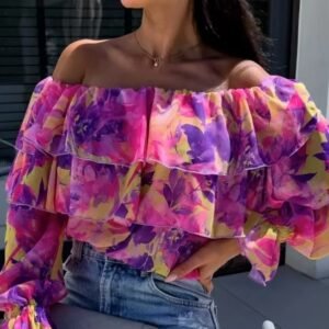 woman wearing colorful off shoulder blouse and jeans