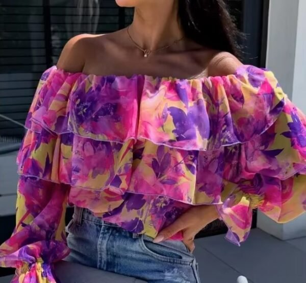 woman wearing colorful off shoulder blouse and jeans