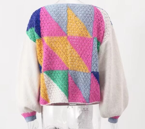 back view of colorful patchwork cardigan on a mannequin