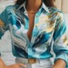 woman wearing blue colorful pattern blouse and white jeans