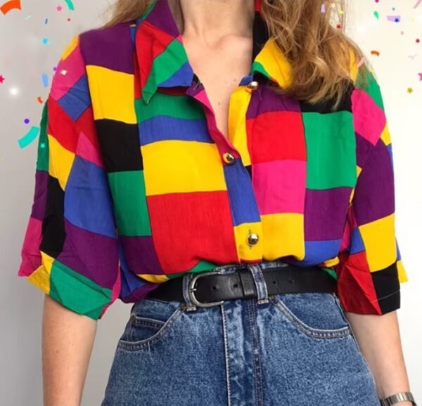 woman wearing colorful plaid blouse and jeans