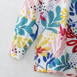 the sleeve of colorful print blouse on the white background