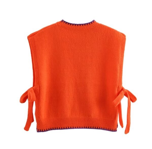 back view of orange colorful sleeveless sweater on the white background