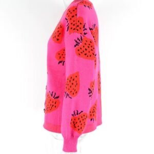 side view of colorful strawberry cardigan on a mannequin, white background