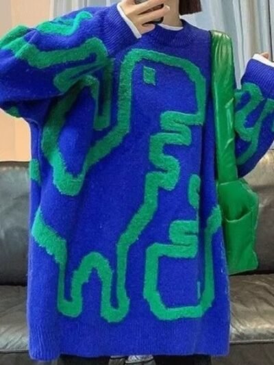 woman wearing colorful streetwear sweater and a green bag