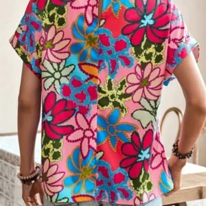 woman turned to her back wearing colorful summer blouse