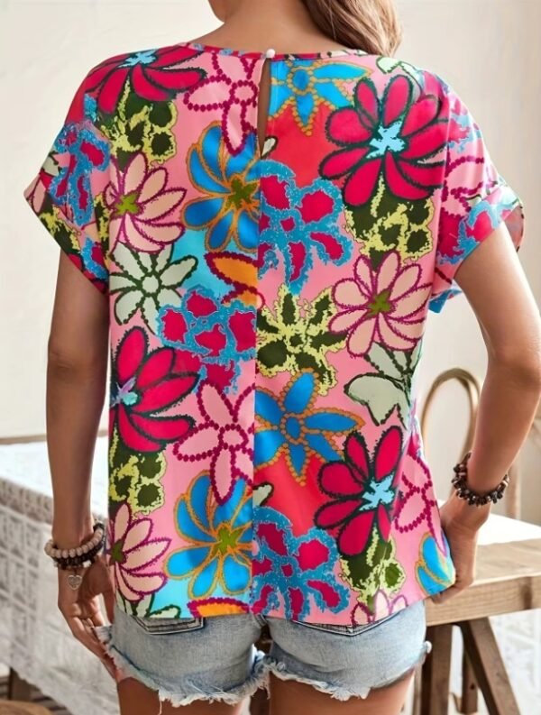 woman turned to her back wearing colorful summer blouse