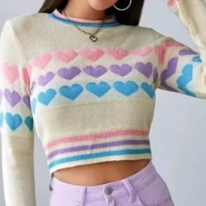 woman wearing colorful sweater with hearts and lifting one hand up