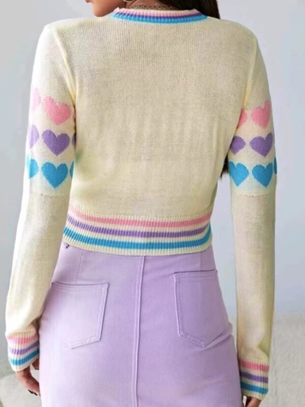 woman turned to her back wearing colorful sweater with hearts and lavender pencil skirt