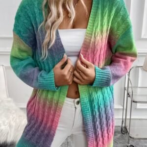 woman wearing colorful tie dye cardigan, white top and white jeans