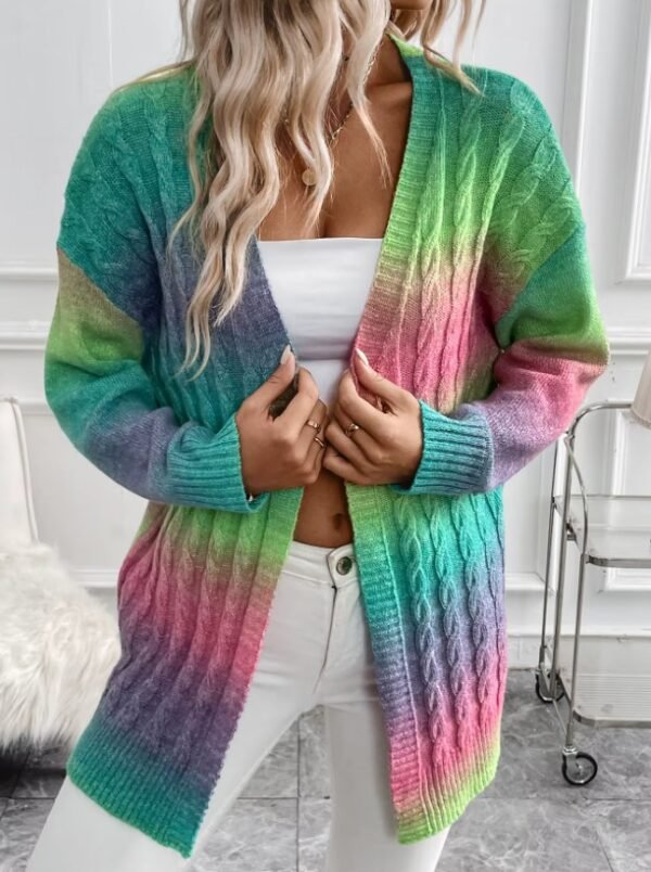 woman wearing colorful tie dye cardigan, white top and white jeans