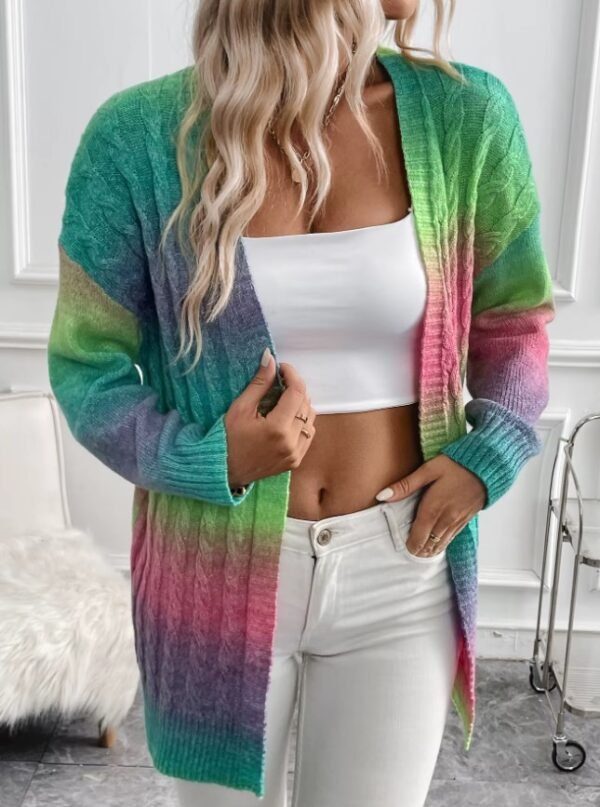 blonde woman wearing colorful tie dye cardigan, white top and white jeans