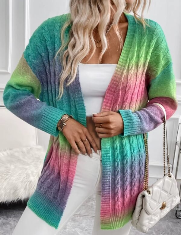 woman wearing colorful tie dye cardigan and holding its edge