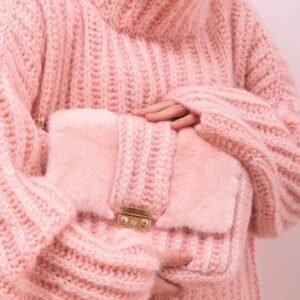 woman wearing pink colorful turtleneck sweater and holding a fluffy pink purse