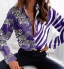 woman wearing purple colorful zebra blouse and black jeans