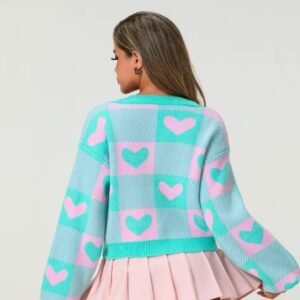 woman turned to her back wearing cute colorful cardigan and a pink skirt