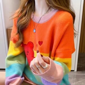 woman wearing cute colorful sweater and holding one hand up