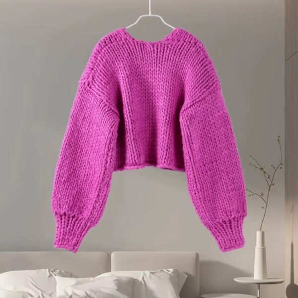 back view of fuchsia cardigan on the grey background