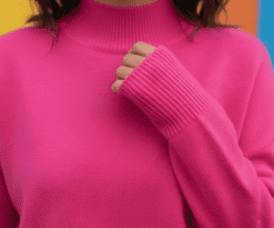 material of fuchsia sweater zoomed in