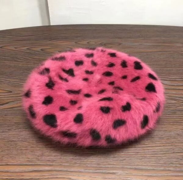 glamorous colorful beret laying on the wooden table