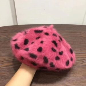 the side of glamorous colorful beret on the wooden table