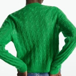 woman turned to her back wearing green cardigan and jeans