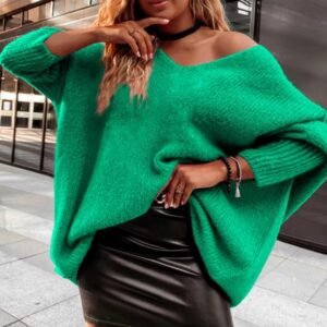 woman wearing green colorful knitted sweater and black pencil skirt on the street