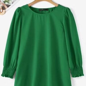 green colorful short-sleeved blouse on the white background