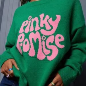 woman wearing green pinky promise colorful sweater