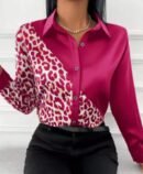 woman wearing pink leopard print colorful blouse and black jeans