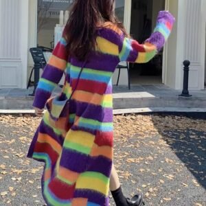 woman turned to her back wearing long colorful cardigan and black boots