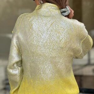 woman turned to her back wearing metallic colorful sweater and silver jeans