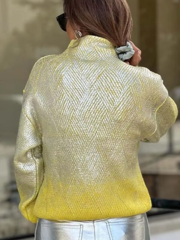 woman turned to her back wearing metallic colorful sweater and silver jeans