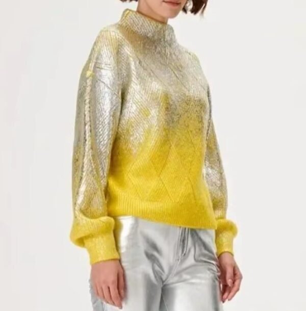 woman turned to her side wearing metallic colorful sweater and silver jeans