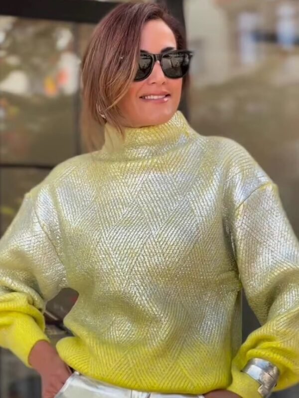 woman with brown hair wearing sunglasses and metallic colorful sweater