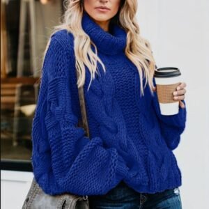 woman wearing navy blue sweater and holding a cup of coffee