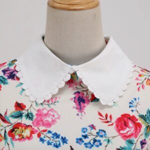 collar of old-fashioned colorful dress on a mannequin