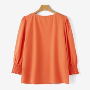 back view of orange colorful short-sleeved blouse